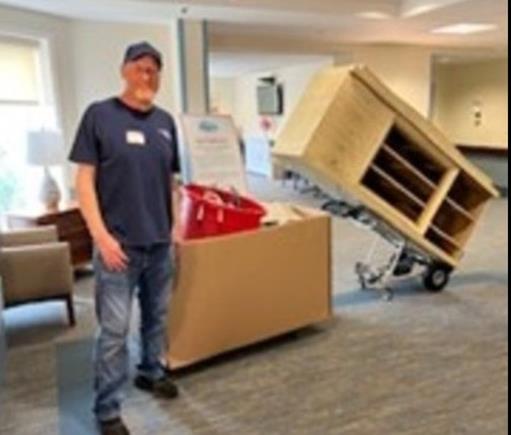 Caring Transitions team member assisting with a senior move at a Denville community, ensuring a smooth and respectful transition.