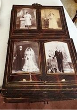 “Antique photo album with vintage wedding portraits discovered during an estate cleanout.”